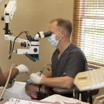 Dr. Kertes with patient in dental chair