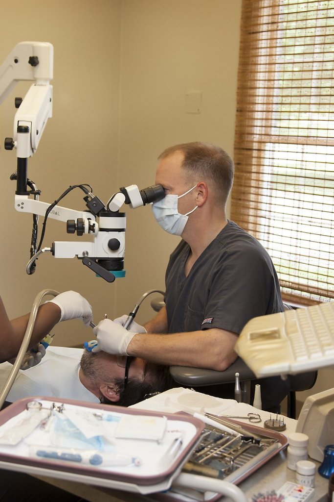 Dr. Kertes with patient in dental chair